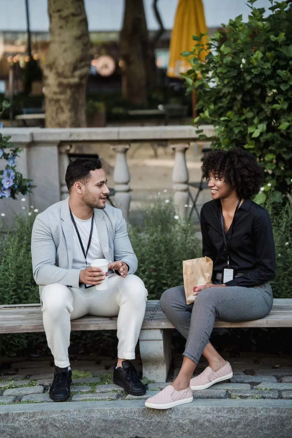 Two colleagues enjoying a conversation outside