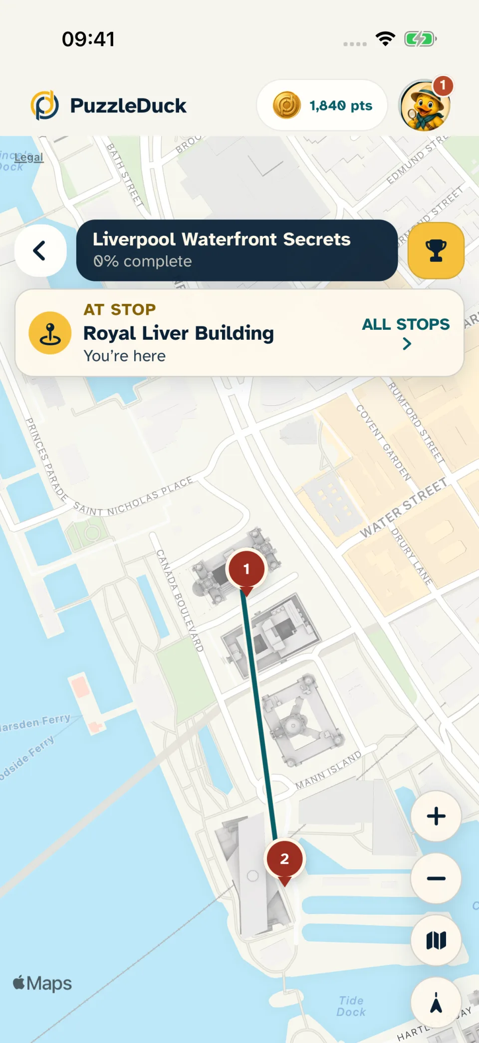 PuzzleDuck app showing a sample hunt map and the current stop at the Royal Liver Building